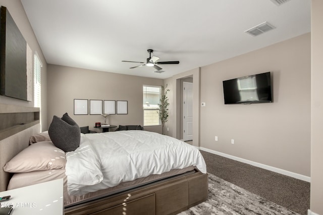 bedroom featuring visible vents, baseboards, a ceiling fan, and carpet flooring