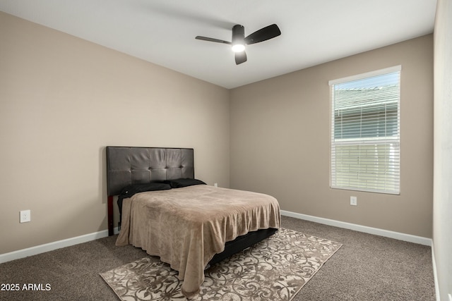 carpeted bedroom with baseboards and ceiling fan