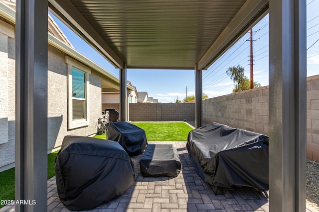 view of patio / terrace featuring area for grilling and a fenced backyard