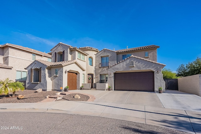 mediterranean / spanish-style home featuring a garage