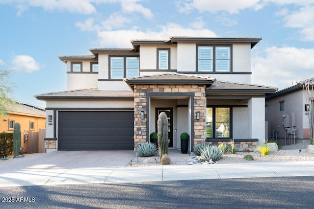 prairie-style home featuring a garage