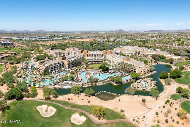 birds eye view of property featuring a water and mountain view