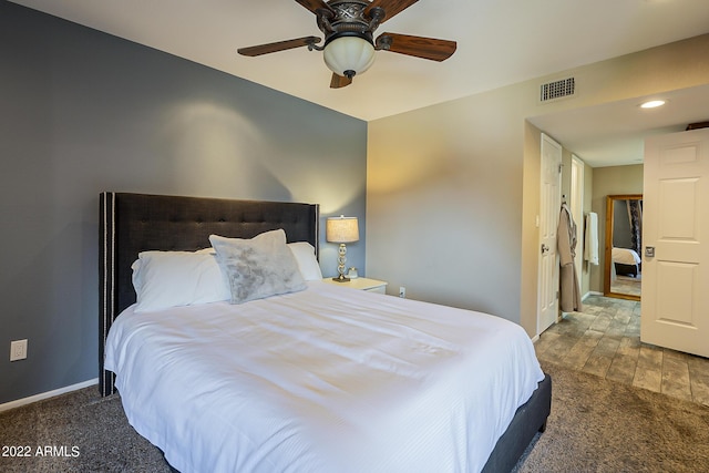 bedroom featuring baseboards, visible vents, and a ceiling fan