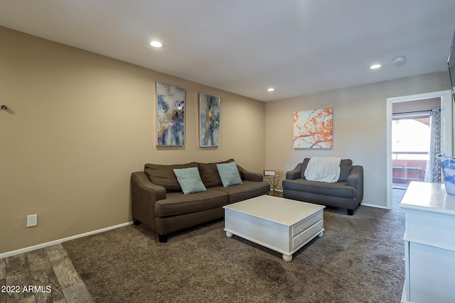 living area featuring dark wood-style floors, recessed lighting, and baseboards