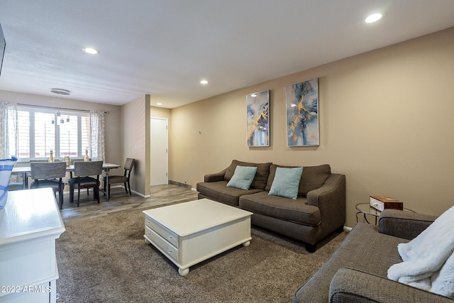 carpeted living area with recessed lighting