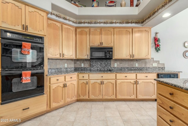 kitchen with light tile patterned floors, light brown cabinetry, black appliances, tasteful backsplash, and dark stone countertops