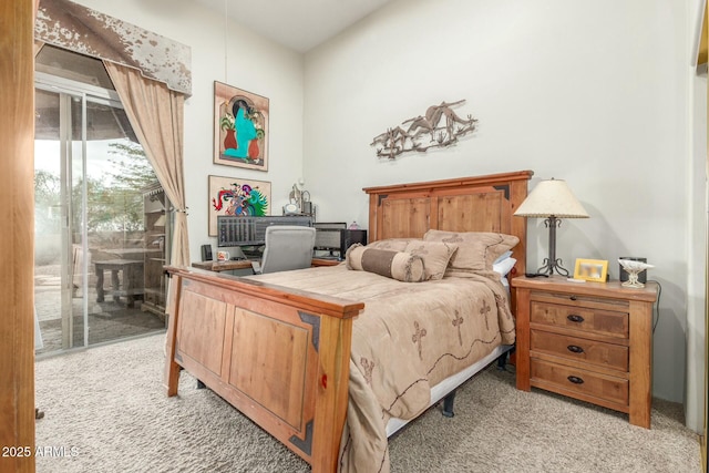 bedroom featuring access to outside and carpet floors