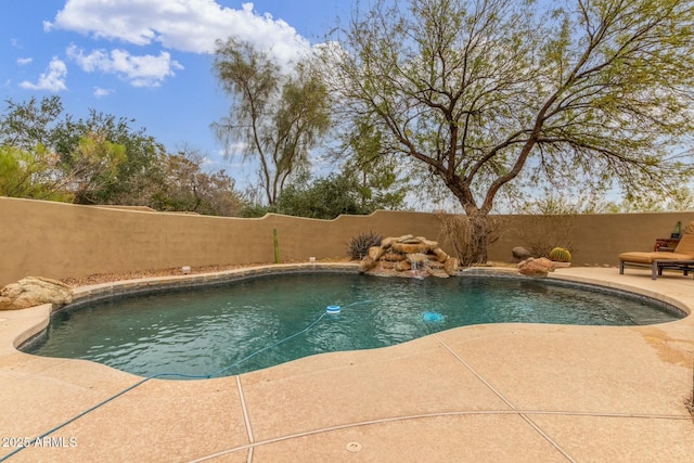 view of pool with a fenced backyard, a fenced in pool, and a patio