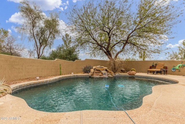 view of pool with a fenced in pool, a fenced backyard, and a patio