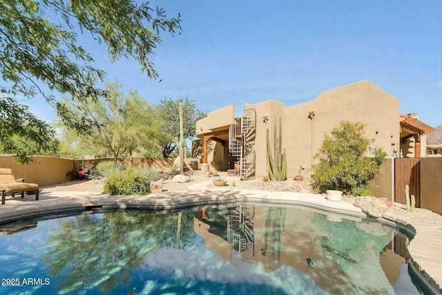 view of pool with a fenced in pool, a fenced backyard, and a patio