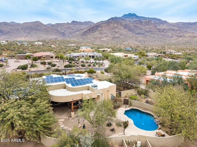 birds eye view of property with a mountain view