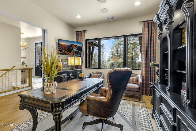 office area featuring hardwood / wood-style flooring and a chandelier