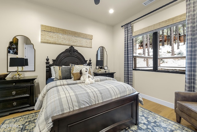 bedroom with light hardwood / wood-style flooring