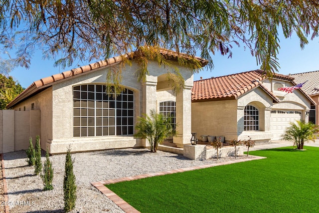 exterior space with a garage and a yard