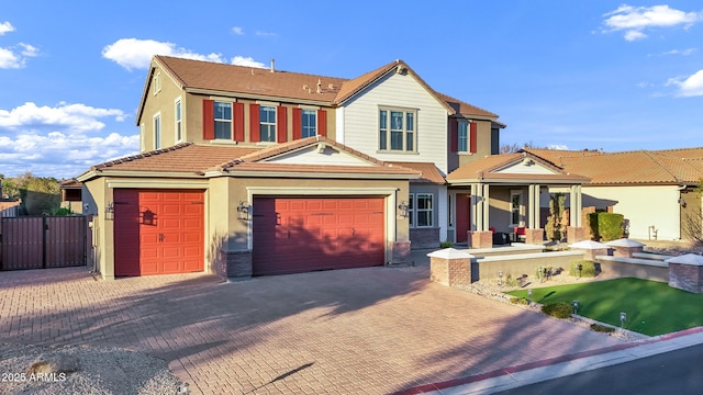 view of front of property with a garage and covered porch