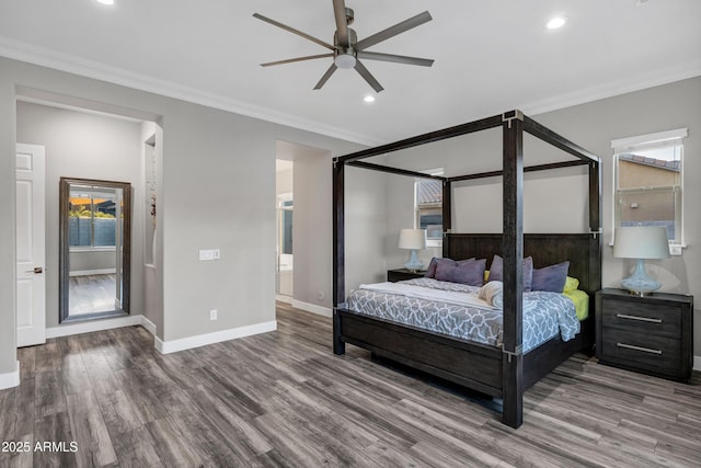 bedroom featuring ornamental molding, hardwood / wood-style floors, ceiling fan, and ensuite bathroom