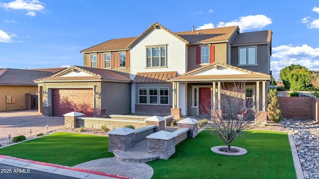 view of front facade with a garage and a front lawn