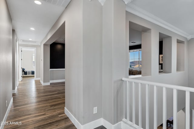 corridor featuring crown molding and dark wood-type flooring