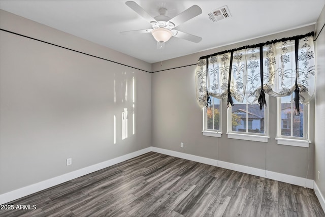 unfurnished room featuring hardwood / wood-style floors and ceiling fan