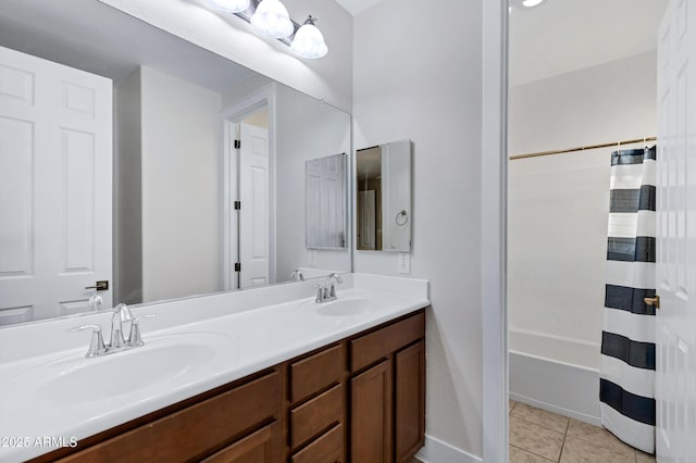 bathroom with tile patterned flooring and vanity