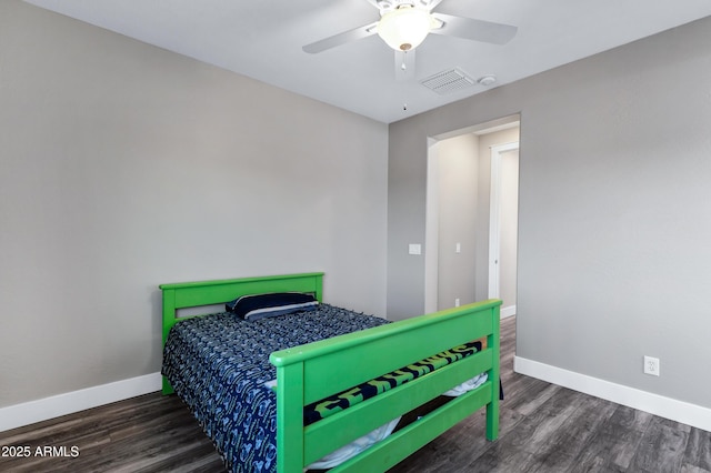 bedroom with dark hardwood / wood-style floors and ceiling fan