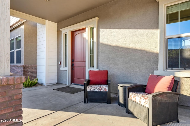 doorway to property with a patio area