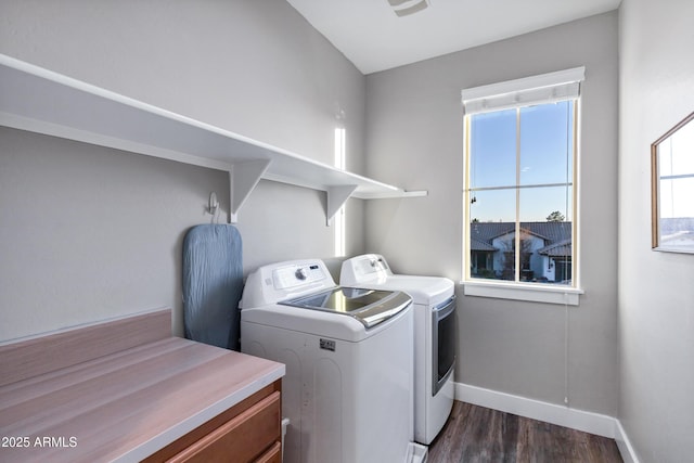 laundry area featuring dark wood-type flooring and independent washer and dryer