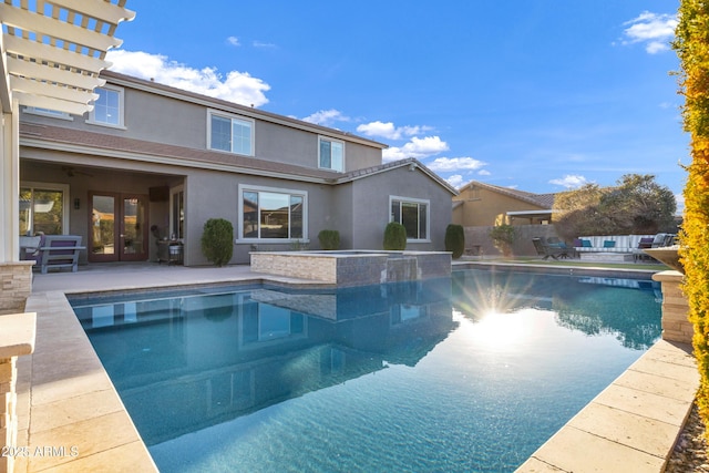 view of pool with an in ground hot tub and a patio area