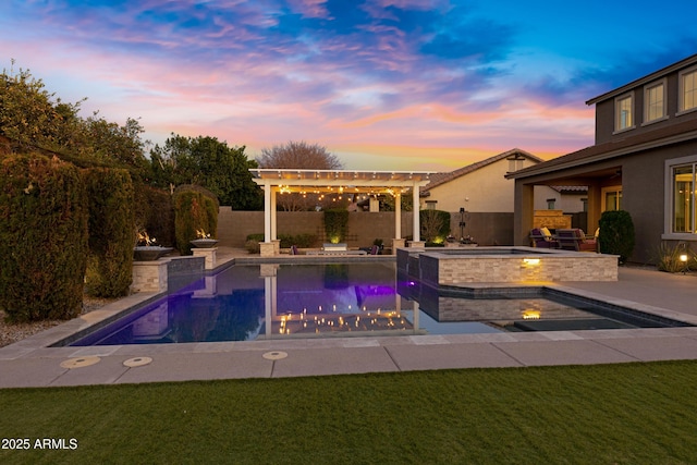 pool at dusk with an in ground hot tub, a patio, and a lawn