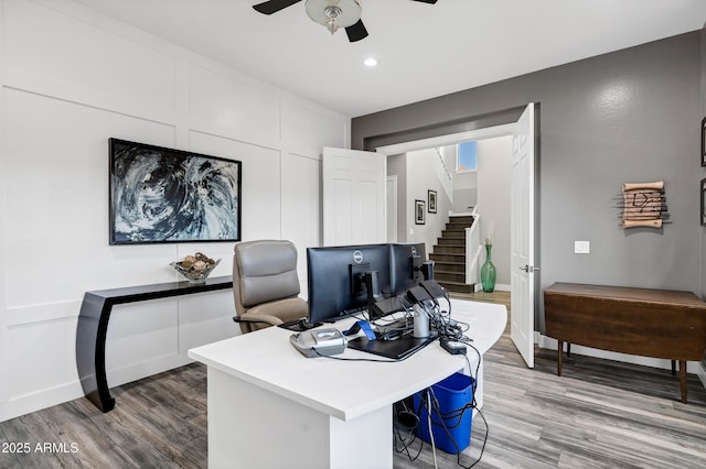 office space featuring ceiling fan and wood-type flooring