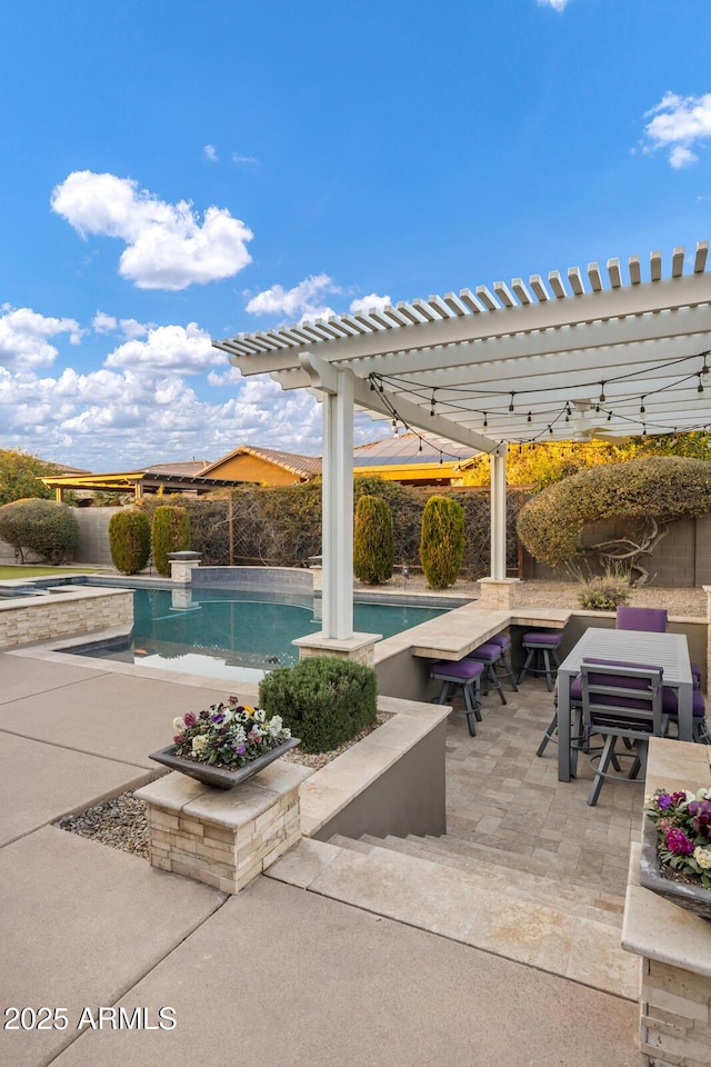 view of pool with a pergola and a patio area