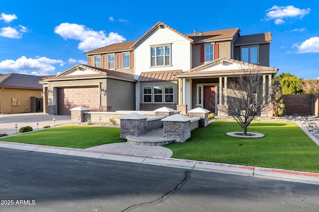 view of front of home with a garage and a front lawn