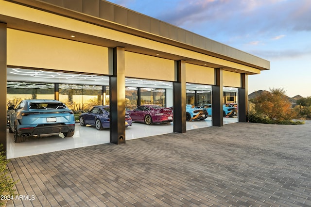 view of garage at dusk