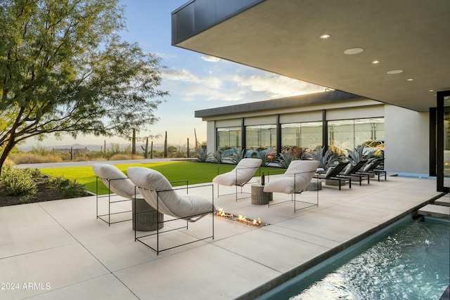 view of patio with an outdoor pool