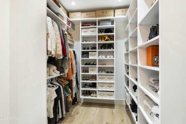 spacious closet with light wood-style floors