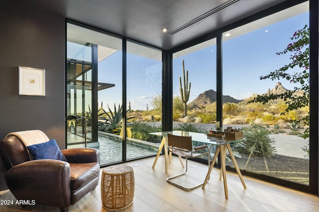 sunroom / solarium with a mountain view