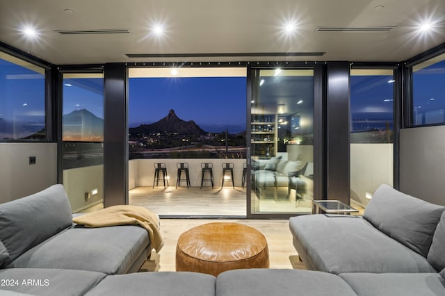 interior space featuring expansive windows and wood finished floors