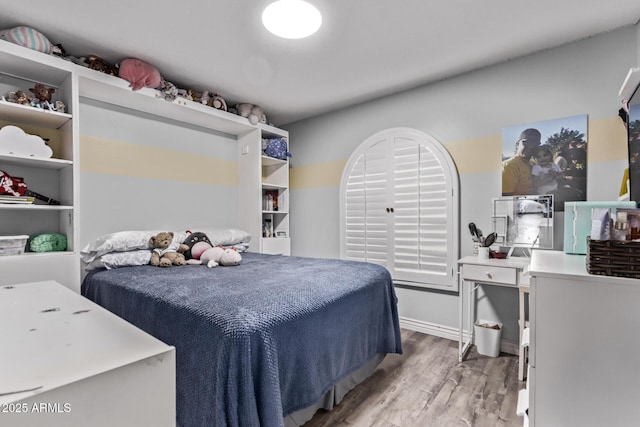 bedroom featuring wood finished floors
