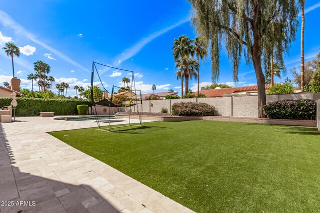 view of yard featuring a fenced backyard, a patio area, and a fenced in pool