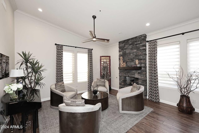 living room with a fireplace, ceiling fan, plenty of natural light, and dark hardwood / wood-style floors