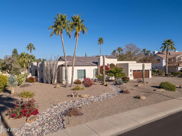 view of front of property with a garage