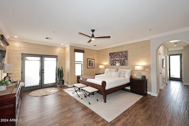 bedroom with dark hardwood / wood-style flooring, ceiling fan, crown molding, and french doors