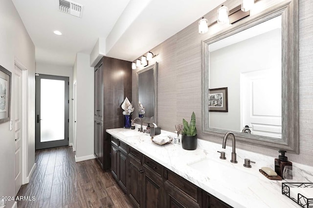 bathroom with vanity and hardwood / wood-style flooring