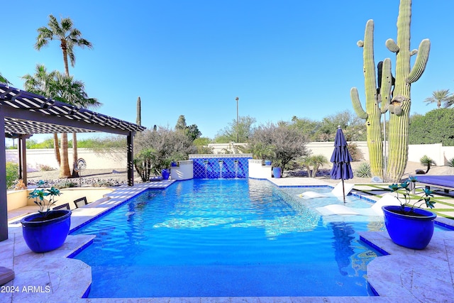 view of swimming pool with pool water feature