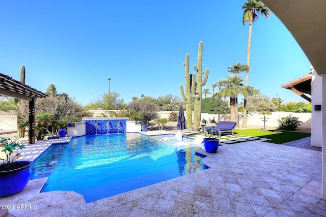 view of swimming pool featuring pool water feature and a patio area