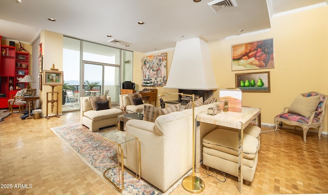 living room with visible vents, floor to ceiling windows, baseboards, and ornamental molding