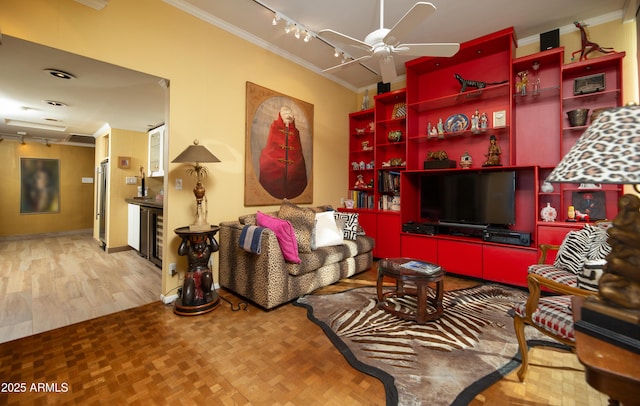 living room featuring crown molding, parquet floors, a ceiling fan, and track lighting