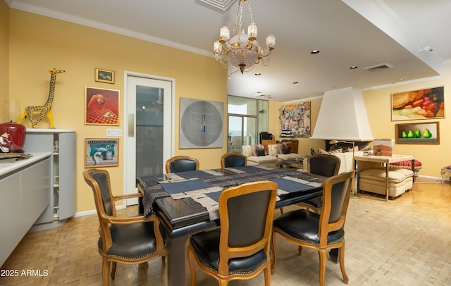 dining area with visible vents, baseboards, an inviting chandelier, and ornamental molding