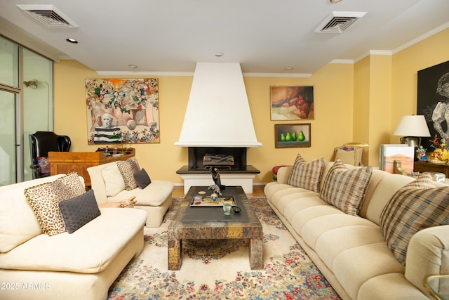 living room with baseboards, a fireplace, visible vents, and ornamental molding