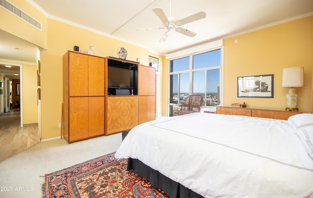 bedroom with baseboards, visible vents, ceiling fan, ornamental molding, and light carpet